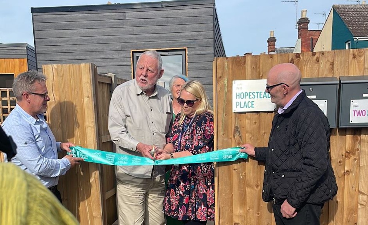 Human rights activist Sir Terry Waite and Hopestead CEO Marie-Claire Delbrouque cut a ribbon at the opening of Hopestead Place